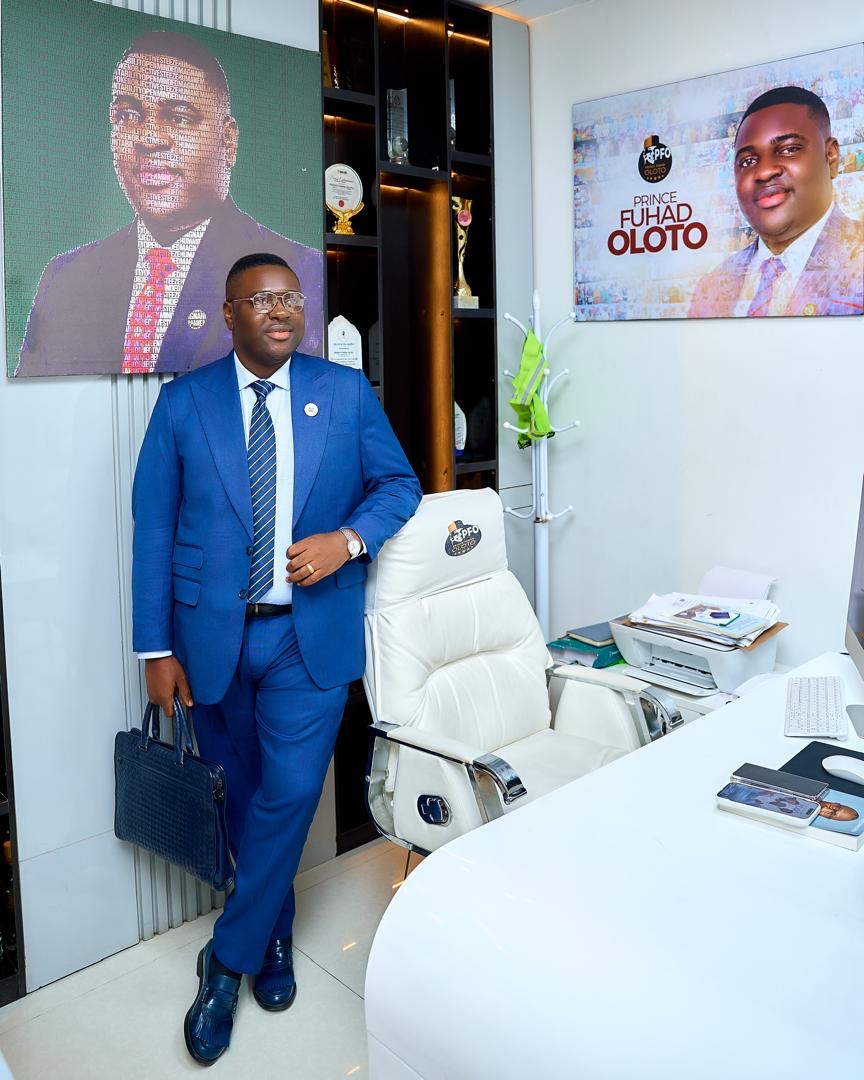 Prince Fuhad Oloto standing in his office