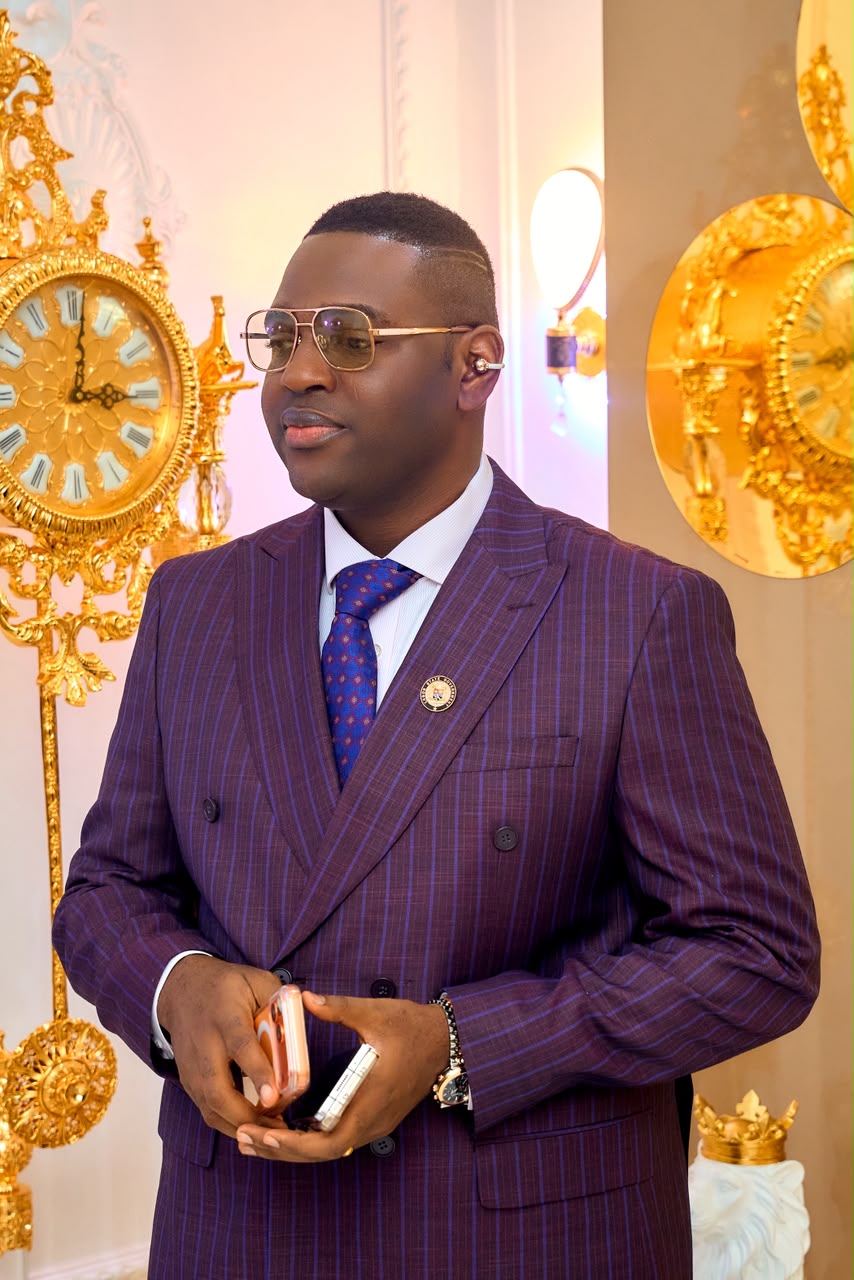 Prince Fuhad Oloto in a purple pinstripe suit