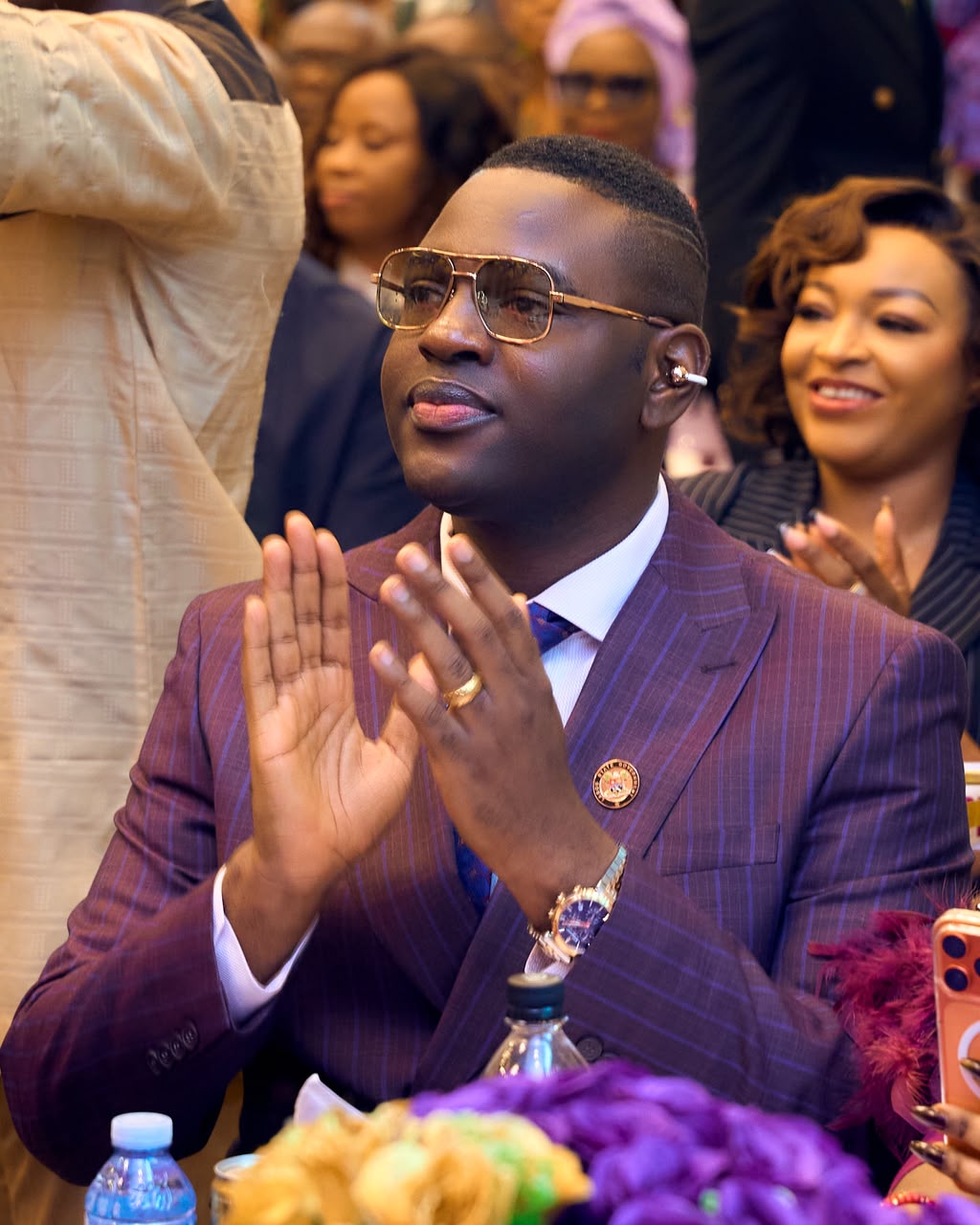 Prince Fuhad Oloto applauding at an event