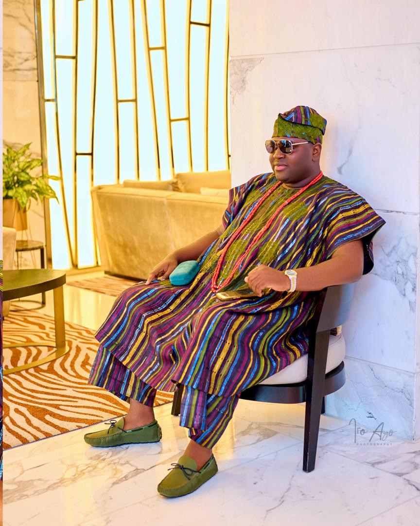 Prince Fuhad Oloto in traditional aso oke attire seated